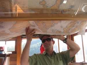 Captain Jeffrey Smith changing paper charts on the Motor Vessel David B